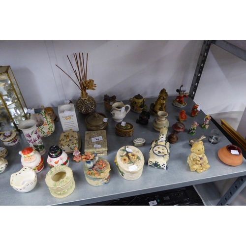 77 - SUNDRY CERAMICS AND RESIN ORNAMENTS INCLUDING; A PAIR OF TINTED BISQUE PIANO BABIES