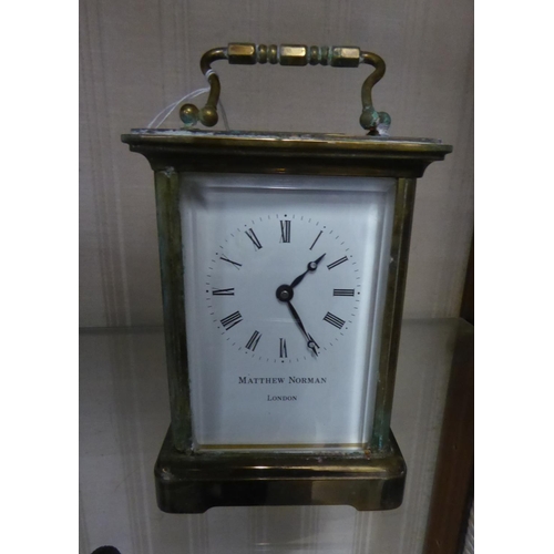 115 - A MODERN BRASS CASED CARRIAGE TIMEPIECE CLOCK, THE DIAL INSCRIBED 'MATHEW NORMAN, LONDON', PRESENTAT... 