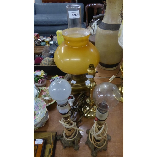 128 - A BRASS OIL TABLE LAMP WITH YELLOW GLASS SHADE AND GLASS FUNNEL, FITTED FOR ELECTRIC LIGHT