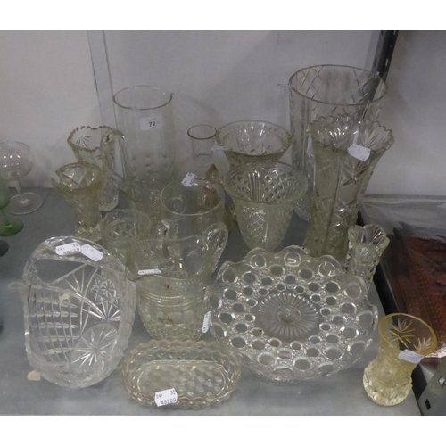 72 - A HEAVY CUT GLASS BEAKER SHAPED VASE; TWO SMALLER CUT GLASS VASES AND OTHER GLASS  VASES ETC..