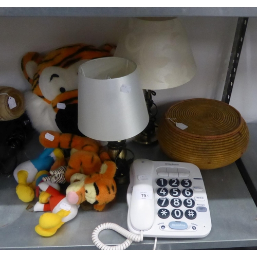 79 - TWO METAL TABLE LAMPS AND SHADES, A TIGERS HEAD CUSHION, A BT BIG BUTTON TELEPHONE HANDSET, A WICKER... 