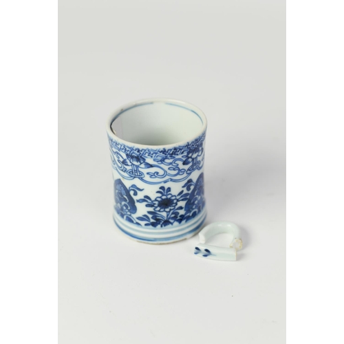 130 - CHINESE QING DYNASTY KANGXI PERIOD HANDLED MUG, painted in underglaze blue with stylised flowers and... 