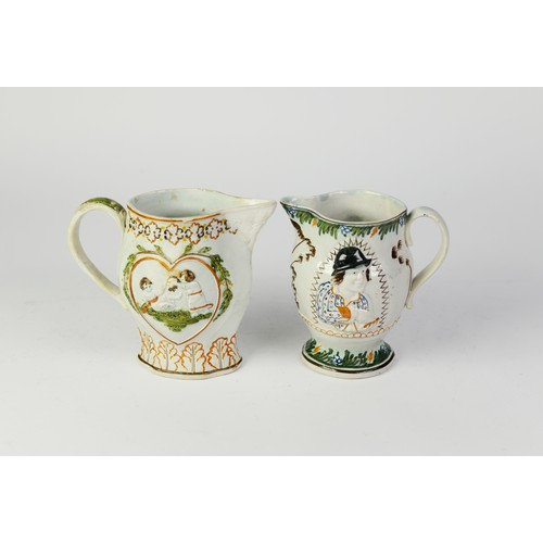 82J - TWO NINETEENTH CENTURY MOULDED PRATT WARE POTTERY JUGS, one of footed form with scroll handle, paint... 