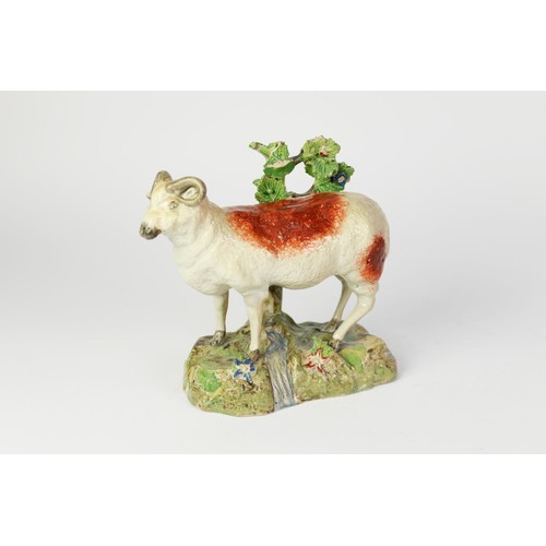 82P - WELL MODELLED NINETEENTH CENTURY STAFFORDSHIRE POTTERY MODEL OF A RAM, painted in colours and modell... 