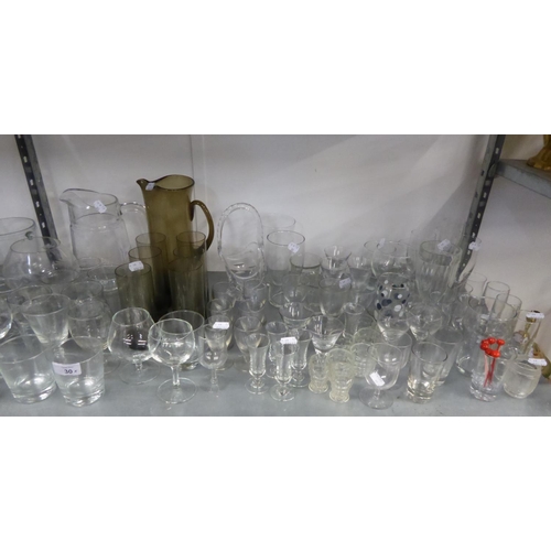 52 - A QUANTITY OF WINE GLASSES AND TUMBLERS, ETC., SOME IN SETS; A SMOKED GLASS TALL WATER JUG AND TUMBL... 