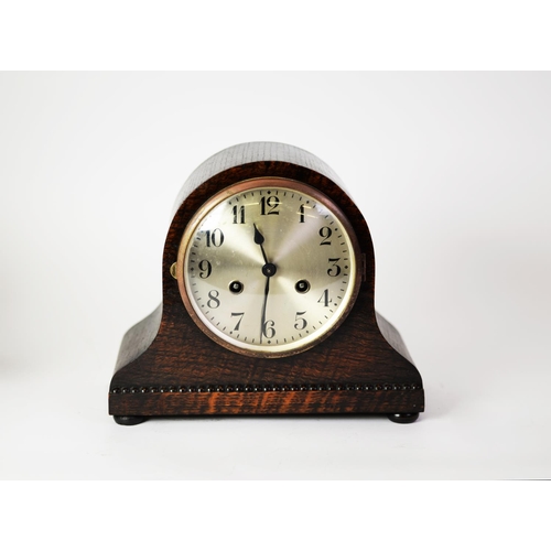 18 - CIRCA 1920's OAK CASED NAPOLEONS HAT SHAPE MANTEL CLOCK WITH MOVEMENT STRIKING ON A COILED GONG AND ... 