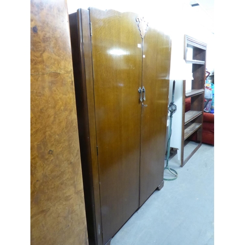 314 - LADY’S AND GENT’S MATCHING OAK TWO DOOR WARDROBES WITH CARVED FEATURES