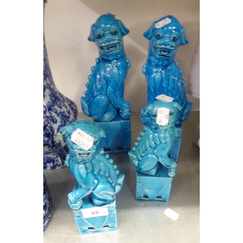 68 - TWO PAIRS OF CHINESE BLUE GLAZED DOGS OF FO, ON SQUARE PLINTHS