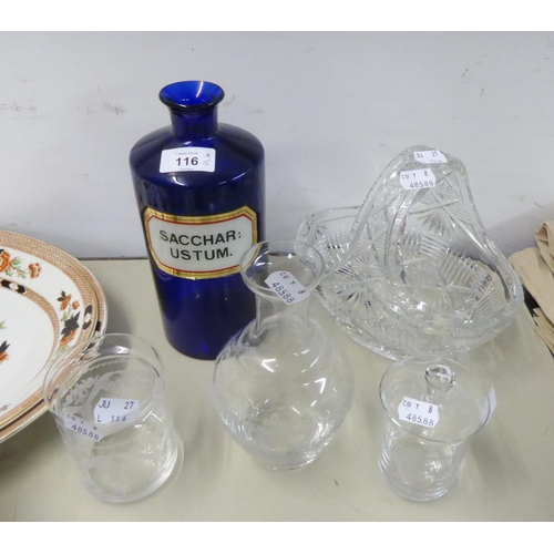 116 - A BLUE GLASS DRUG BOTTLE WITH WHITE LABEL ‘SACCHAR USTRUM’; A HEAVY CUT GLASS BASKET PATTERN FRUIT B... 