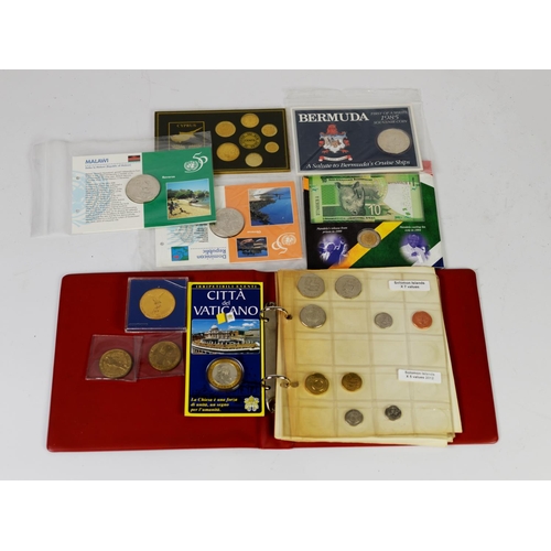 8 - SMALL BOOTS RING BINDER COIN ALBUM CONTAINING WORLD COINAGE SETS, mainly 1980s onwards to include So... 