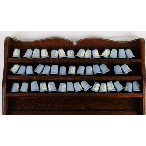 315 - TWO STAINED WOOD OPEN FRONT PIGEON HOLE TYPE MURAL DISPLAY RACKS, containing COLLECTION OF 184 COLLE... 