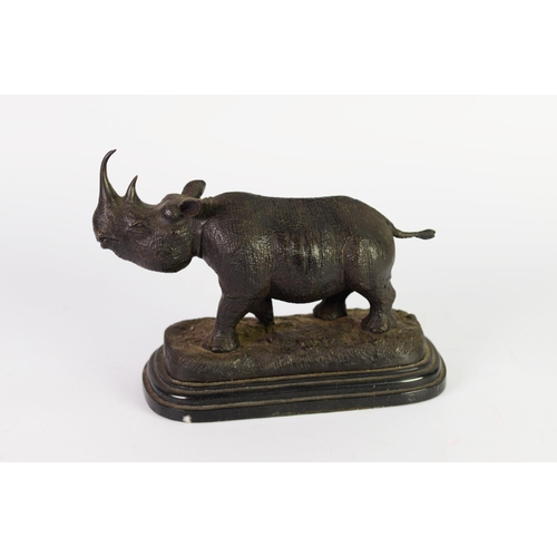 243 - PATINATED BRONZE MODEL OF A RHINOCEROS, SIGNED JULIE MOIGNIEZ, on a moulded black veined marble base... 