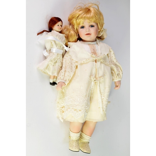 193 - BOXED LEONARDO COLLECTION CERAMIC HEADED COLLECTOR'S DOLL with pigtails and holding a teddy bear, to... 