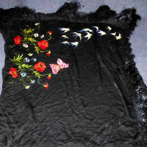 356 - CONTINENTAL BLACK SILK SHAWL, embroidered in one diagonal half with poppies, a large butterfly and f... 