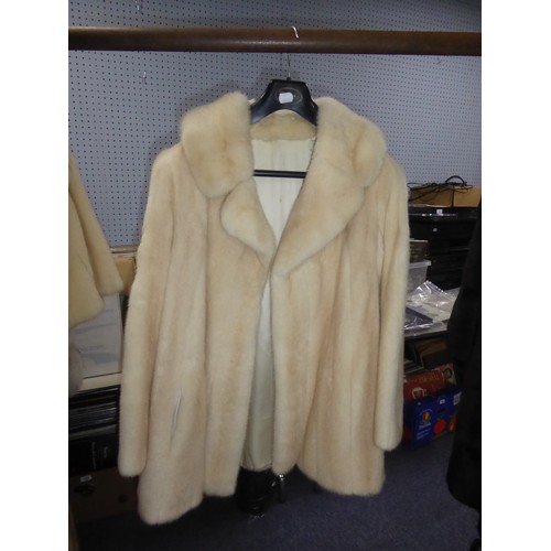 371 - CREAM PASTEL MINK THREE-QUARTER LENGTH COAT with revered collar, double breasted hook fastening fron... 