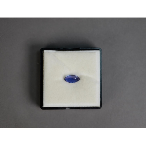 434 - Black plastic sealed vision box containing a MARQUISE SHAPED BLUE GEM STONE