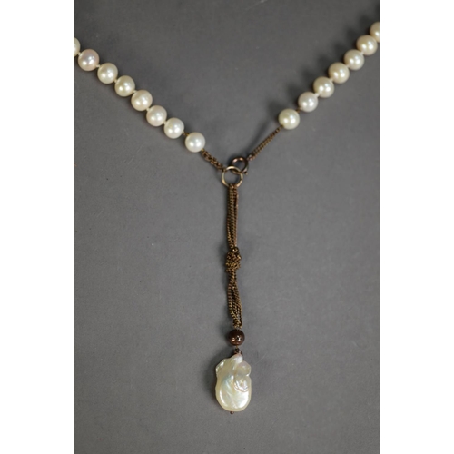 451 - LONG, SINGLE STRAND NECKLACE OF LARGE UNIFORM CULTURED PEARLS, terminating in a fine chain and a lar... 