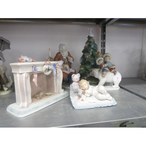 7 - FIVE MODERN PIECES OF LLADRO PORCELAIN comprising; Santa Claus, a Fireplace with hanging Stockings, ... 