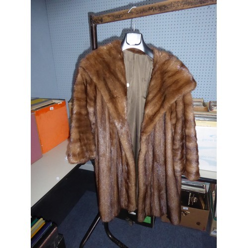 370 - LIGHT BROWN FULL-LENGTH FUR COAT with deep shawl collar, slit pockets, interior silk tie fastening b... 