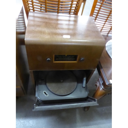 PYE WALNUT CASED RADIOGRAM WITH MAINS RADIO OVER A PULL-DOWN FRONT WITH ...