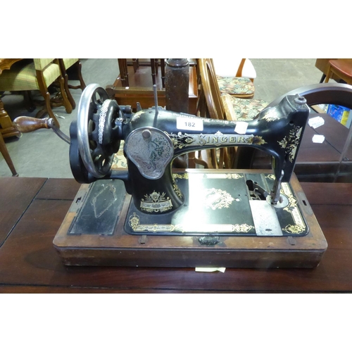 360 - SINGER MANUAL PORTABLE SEWING MACHINE AND A MILESTONE SHAPED WALL MIRROR (2)