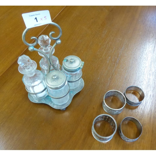 1 - THREE HALLMARKED SILVER NAPKIN RINGS, including two floral engraved examples, ANOTHER IN E.P, and an... 