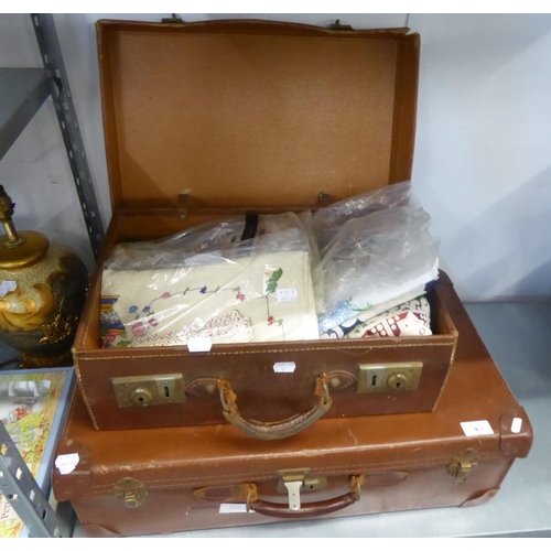 9 - VINTAGE BROWN SUITCASE, ANOTHER SMALLER AND A QUANTITY OF LINEN VARIOUS