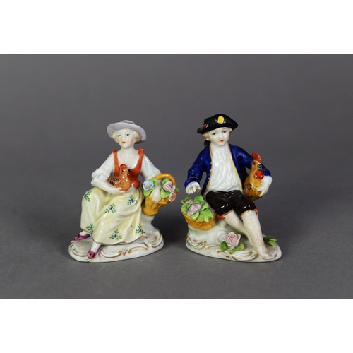 7 - PAIR OF SITZENDORF PORCELAIN SMALL FIGURES, each painted in colours and gilt and modelled seated, wi... 