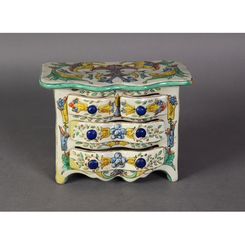 15 - CONTINENTAL MAIOLICA POTTERY MINIATURE CHEST OF DRAWERS, with shaped front and two short and wo long... 