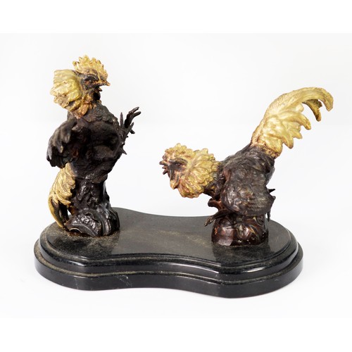 69 - 20th CENTURY BRONZED METAL FIGURES OF TWO FIGHTING COCKS, with gilt painted detail mounted on a step... 