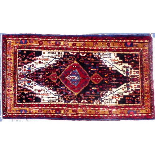 1 - PERSIAN HAMADAN CARPET with large concentric diamond shaped crimson on midnight blue on a white and ... 