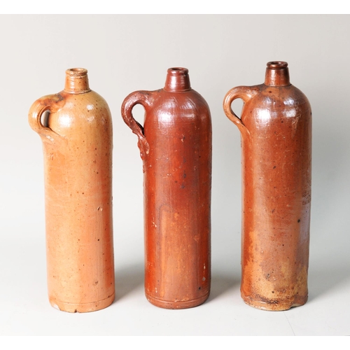 317 - THREE ANTIQUE GERMAN STONEWARE WINE BOTTLES IMPRESSED GEORG KREUZBERG, AHRWEILER, RHEINPREUSSEN, 12