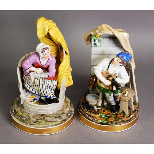 267 - GOOD QUALITY PAIR OF CONTINENTAL PORCELAIN SEATED FIGURES OF A COBBLER AND HIS WIFE, painted in colo... 