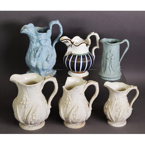 273 - SIX NINETEENTH CENTURY MOULDED POTTERY JUGS, comprising: A GRADUATED SET OF THREE COPELAND JUGS IN W... 