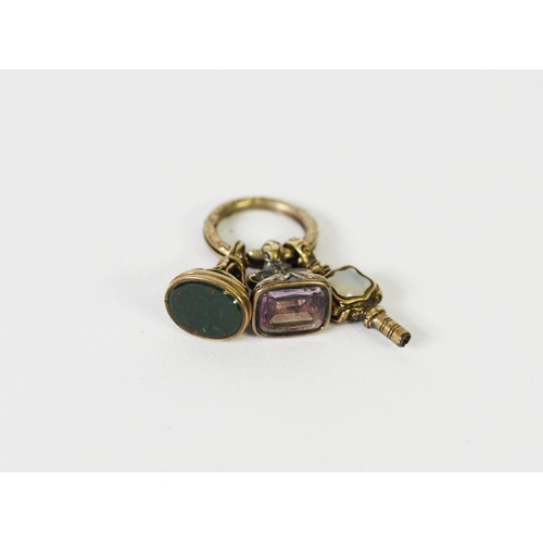 18 - TWO 19th CENTURY SMALL GOLD COLOURED METAL FOB SEALS, one set with an oblong amethyst and one with a... 