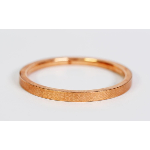 98 - 9ct GOLD HOLLOW BANGLE with engine turned flat top, 3 1/4in (8.5cm) overall diameter, Birmingham 192... 