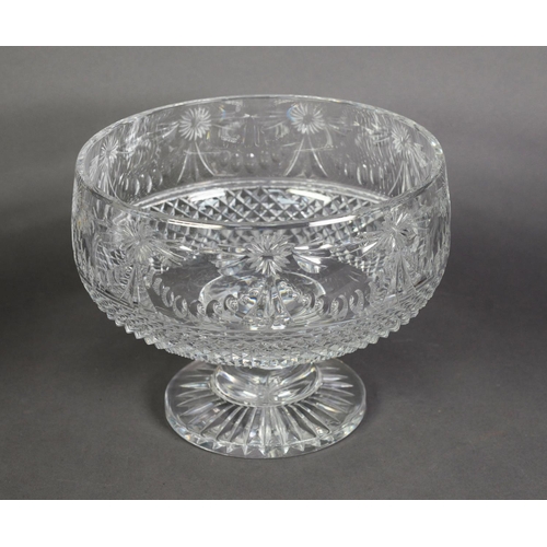 576 - STUART HEAVY CUT GLASS PEDESTAL PUNCH BOWL, decorated with flower head tied swags above a stud cut b... 