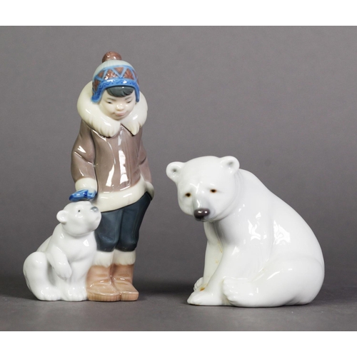 579 - TWO LLADRO, SPANISH PORCELAIN FIGURES, one modelled as an ESKIMO BOY STANDING NEXT TO A SEATED POLAR... 