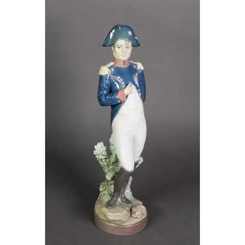 580 - LLADRO, SPANISH PORCELAIN FIGURE OF NAPOLEON, modelled standing, in military uniform, on a circular ... 