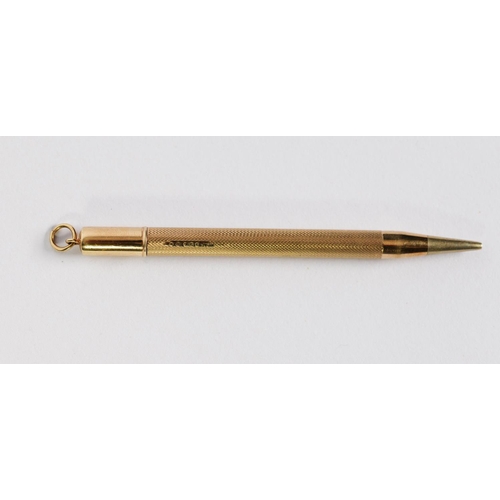 72 - 9ct GOLD SLIM PROPELLING PENCIL with engine turned decoration, ring hanger to the top, 4in (10cm) lo... 