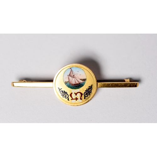 124 - 15ct GOLD BAR BROOCH with disc centre enamelled with a large yacht and monogram, 5.5gms