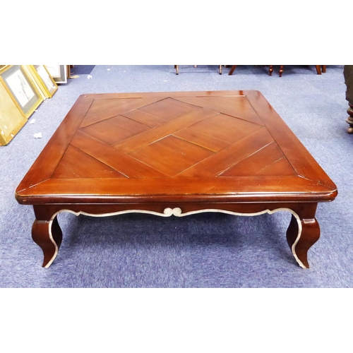 483 - LARGE WALNUT SQUARE COFFEE TABLE with sectional top and with shaped apron and stylised cabriole legs... 