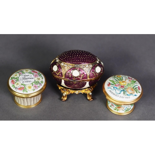 558 - TWO HALCYON DAYS ENAMELLED ‘MOTHER’S DAY’ SMALL BOXES with hinged lids and an enamelled and a gilt b... 