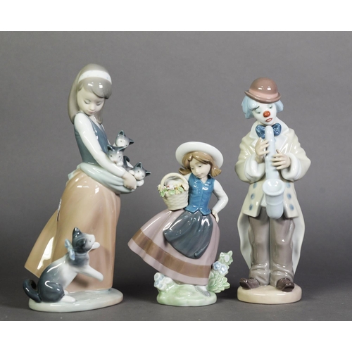 572 - THREE LLADRO FIGURE GROUPS, Saxophone Clown, Crazy Cat Lady, and Girl with Basket of Flowers; 9 5/8