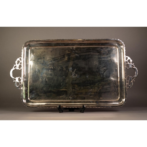 468 - ELECTROPLATED TWO HANDLED OBLONG TEA TRAY, initialled 'L', with cavetto borders and wavy edge, cast ... 