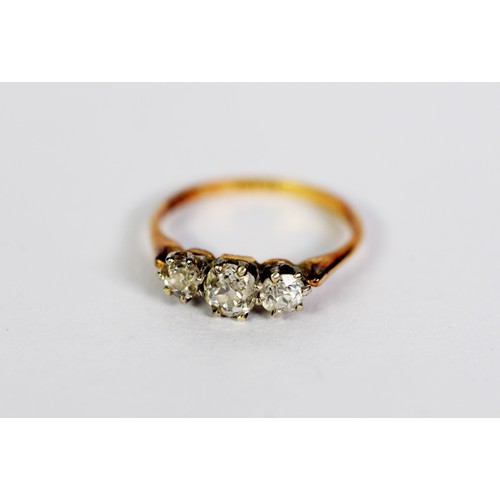 90 - 18ct GOLD AND PLATINUM RING set with three old cut round diamonds, the centre stone approximately .4... 