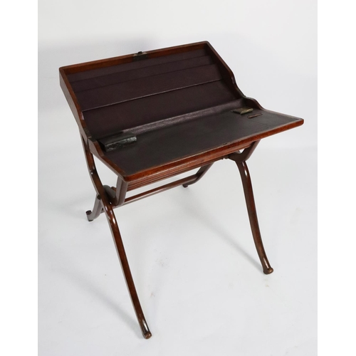 52 - LATE NINETEENTH CENTURY WALNUT CAMPAIGN DESK OR WRITING TABLE, the oblong, panelled top opening to r... 