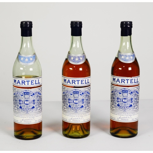 42 - THREE BOTTLES OF MID CENTURY MARTELL THREE STAR ‘VERY OLD PALE COGNAC’, with blue printed labels and... 