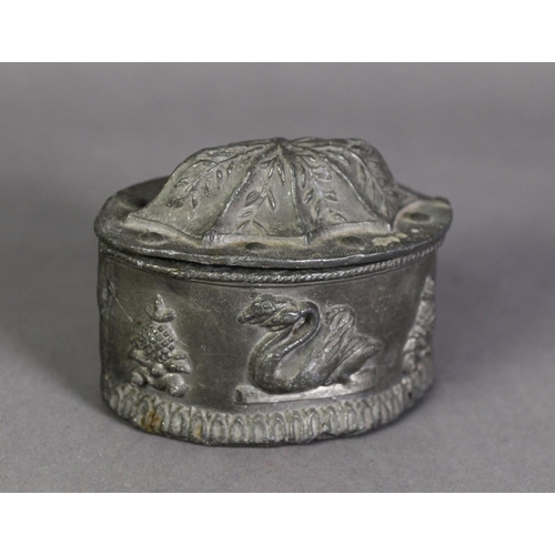 30 - NINETEENTH CENTURY LEAD TOBACCO BOX AND COVER, of elliptical form, the sides embossed with pineapple... 