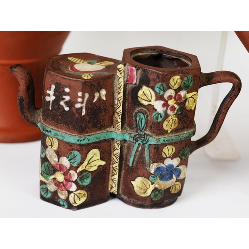 32 - LATE 19TH/EARLY 20TH CENTURY YIXING TEAPOT DECORATED IN SCROLLLING VINES, together with a similar pe... 